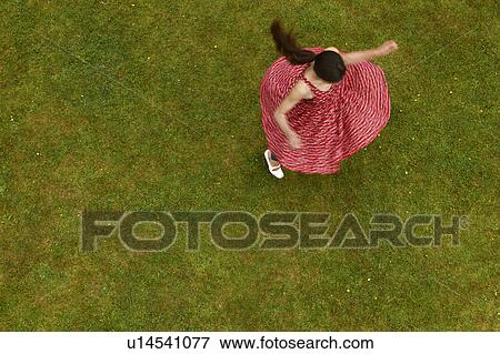 Woman spinning outdoors View Large Photo Image Stock Photo - Woman spinning outdoors. Fotosearch