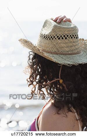 Woman wearing sunhat on beach View Large Photo Image Stock Photography - Woman wearing sunhat on beach. Fotosearch