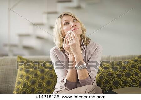Woman wiping tears from cheeks View Large Photo Image Stock Photograph - Woman wiping tears from cheeks. Fotosearch
