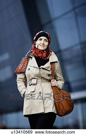 Woman with cell phone in headscarf View Large Photo Image Stock Photo - Woman with cell phone in headscarf. Fotosearch