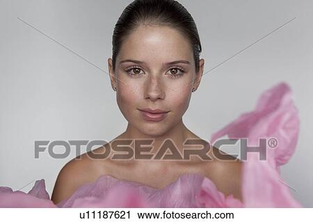 Stock Image - Woman wrapped in tissue paper. Fotosearch