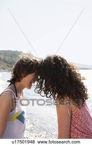 Women laughing together outdoors View Large Photo Image Stock Photo - Women laughing together outdoors. Fotosearch