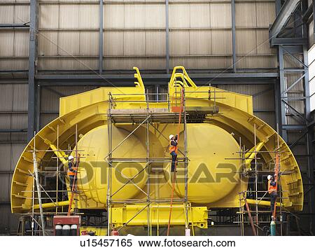 Workers building ship components View Large Photo Image Stock Photography - Workers building ship components. Fotosearch