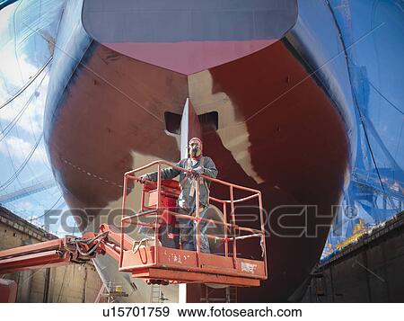 Workers talking at shipbuilding site View Large Photo Image Stock Photo - Workers talking at shipbuilding site. Fotosearch