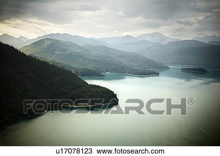 Aerial view of mountains and still lake View Large Photo Image Stock Image - Aerial view of mountains and still lake. Fotosearch