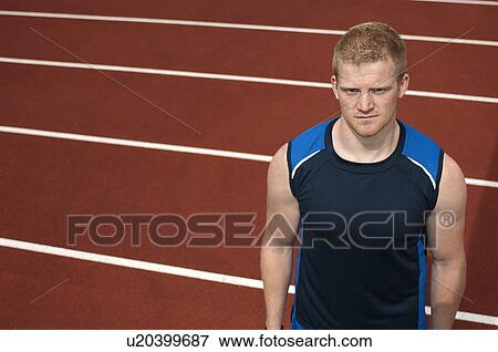 Stock Photo - Athlete standing on track. Fotosearch