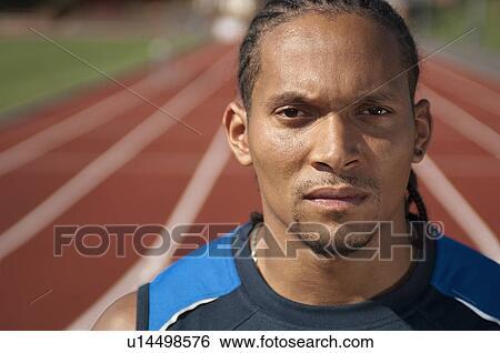 Athlete standing on track View Large Photo Image Stock Photograph - Athlete standing on track. Fotosearch