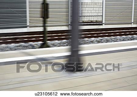 Blurred view of train station View Large Photo Image Stock Image - Blurred view of train station. Fotosearch