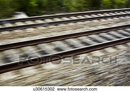 Blurred view of train tracks View Large Photo Image Stock Image - Blurred view of train tracks. Fotosearch
