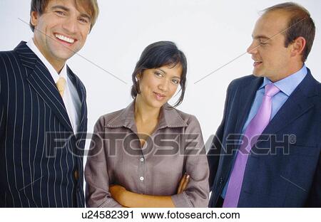 Stock Image - Business people talking in office. Fotosearch