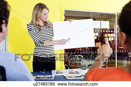 Businesswoman holding blank card View Large Photo Image Stock Photography - Businesswoman holding blank card. Fotosearch