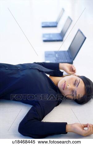 Businesswoman sleeping in office View Large Photo Image Stock Photography - Businesswoman sleeping in office. Fotosearch