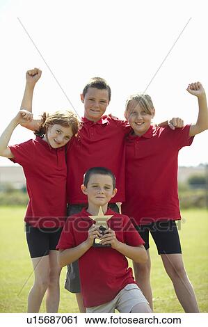 Children cheering with trophy outdoors View Large Photo Image Stock Image - Children cheering with trophy outdoors. Fotosearch