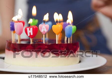 Close up of candles in birthday cake View Large Photo Image Stock Image - Close up of candles in birthday cake. Fotosearch
