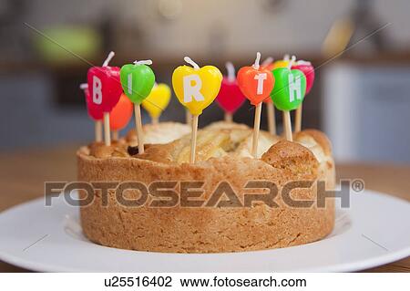 Close up of candles in birthday cake View Large Photo Image Stock Image - Close up of candles in birthday cake. Fotosearch