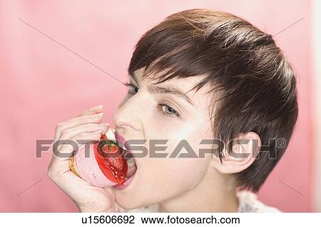 Close up of woman eating dessert View Large Photo Image Stock Image - Close up of woman eating dessert. Fotosearch