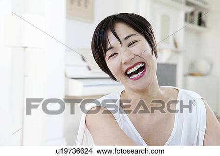 Close up of woman laughing View Large Photo Image Picture - Close up of woman laughing. Fotosearch
