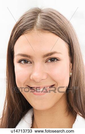 Stock Image - Close up of woman's smiling face. Fotosearch