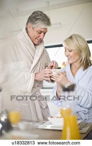 Couple having breakfast together View Large Photo Image Stock Image - Couple having breakfast together. Fotosearch