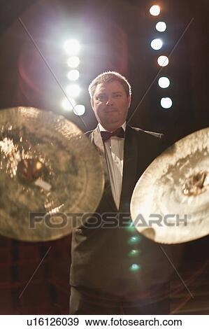 Stock Photo - Cymbals player in orchestra. Fotosearch