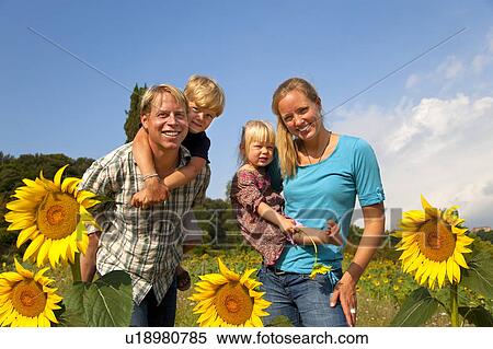 Family walking in field of flowers View Large Photo Image Stock Photography - Family walking in field of flowers. Fotosearch