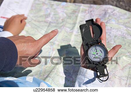 Father and son using compass and map View Large Photo Image Stock Photo - Father and son using compass and map. Fotosearch