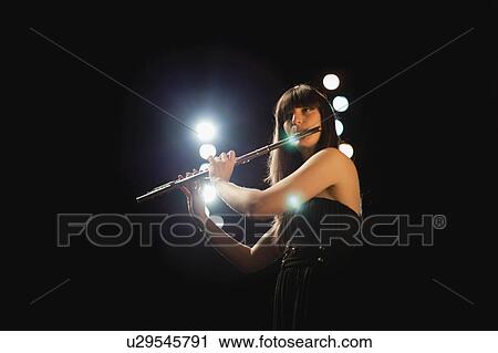 Flute player on stage View Large Photo Image Stock Image - Flute player on stage. Fotosearch