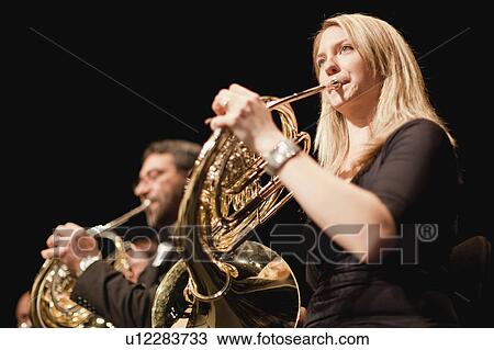 French horn players in orchestra View Large Photo Image Stock Image - French horn players in orchestra. Fotosearch