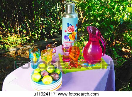 Fruit and beverages on picnic table View Large Photo Image Stock Photo - Fruit and beverages on picnic table. Fotosearch