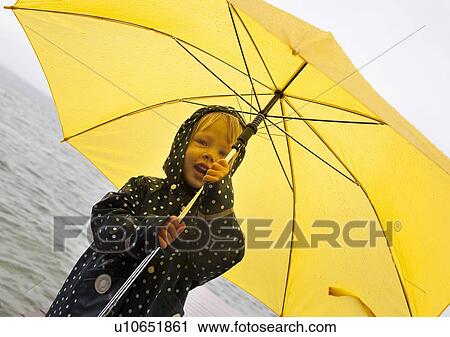 Girl holding yellow umbrella by lake View Large Photo Image Stock Image - Girl holding yellow umbrella by lake. Fotosearch