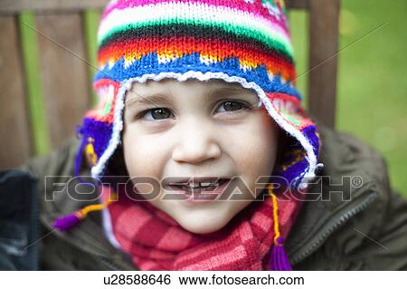 Girl wearing coat, scarf and hat View Large Photo Image Stock Photograph - Girl wearing coat, scarf and hat. Fotosearch