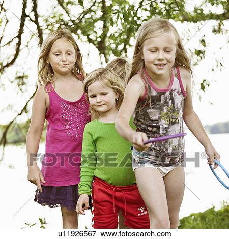 Girls playing with rings together View Large Photo Image Stock Photo - Girls playing with rings together. Fotosearch