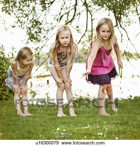 Girls playing with rings together View Large Photo Image Stock Photo - Girls playing with rings together. Fotosearch