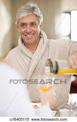 Man having breakfast with wife View Large Photo Image Stock Image - Man having breakfast with wife. Fotosearch