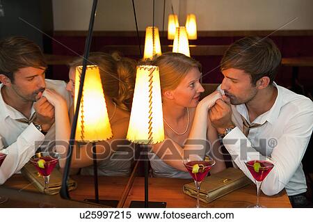 Man kissing girlfriend in restaurant View Large Photo Image Stock Photography - Man kissing girlfriend in restaurant. Fotosearch