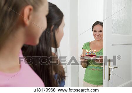 Mother with birthday cake for daughter View Large Photo Image Stock Photo - Mother with birthday cake for daughter. Fotosearch