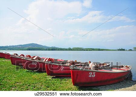 Numbered boats docked by lake View Large Photo Image Stock Image - Numbered boats docked by lake. Fotosearch