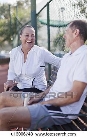 Older couple talking on park bench View Large Photo Image Stock Image - Older couple talking on park bench. Fotosearch