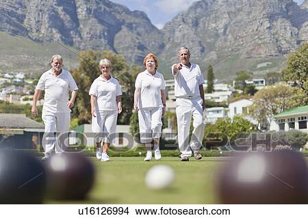 Older couples lawn bowling View Large Photo Image Picture - Older couples lawn bowling. Fotosearch