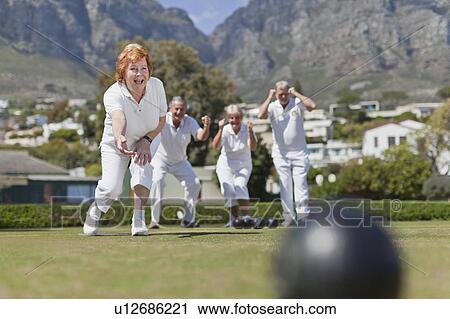 Older couples playing lawn bowling View Large Photo Image Stock Image - Older couples playing lawn bowling. Fotosearch