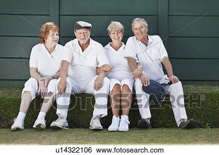 Older couples relaxing outdoors together View Large Photo Image Stock Photograph - Older couples relaxing outdoors together. Fotosearch