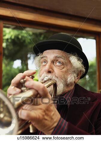Older man playing trumpet View Large Photo Image Picture - Older man playing trumpet. Fotosearch