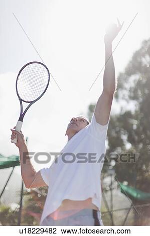 Older man serving tennis ball View Large Photo Image Stock Image - Older man serving tennis ball. Fotosearch