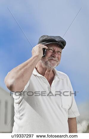 Older man talking on cell phone View Large Photo Image Stock Photo - Older man talking on cell phone. Fotosearch