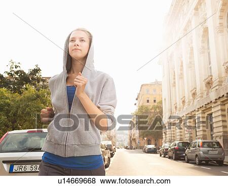 Runner jogging on city street View Large Photo Image Stock Photo - Runner jogging on city street. Fotosearch