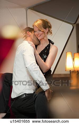 Smiling couple dancing in bar View Large Photo Image Stock Photography - Smiling couple dancing in bar. Fotosearch