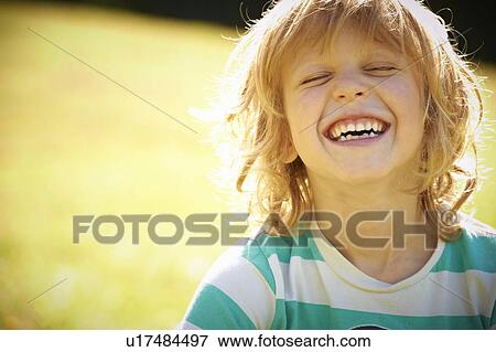 Smiling girl laughing outdoors View Large Photo Image Stock Photo - Smiling girl laughing outdoors. Fotosearch