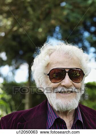 Smiling older man wearing sunglasses View Large Photo Image Stock Image - Smiling older man wearing sunglasses. Fotosearch