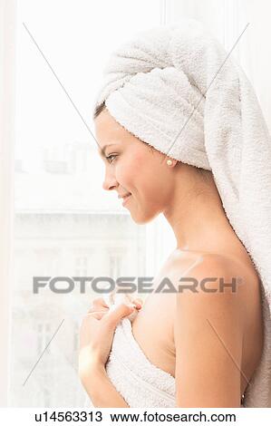 Smiling woman wrapped in towels View Large Photo Image Stock Image - Smiling woman wrapped in towels. Fotosearch