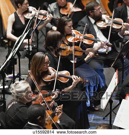 Picture - String section in orchestra. Fotosearch